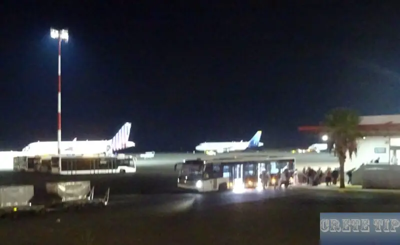Passengers leave the shuttle bus